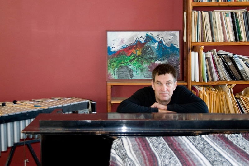 man resting on a musical instrument