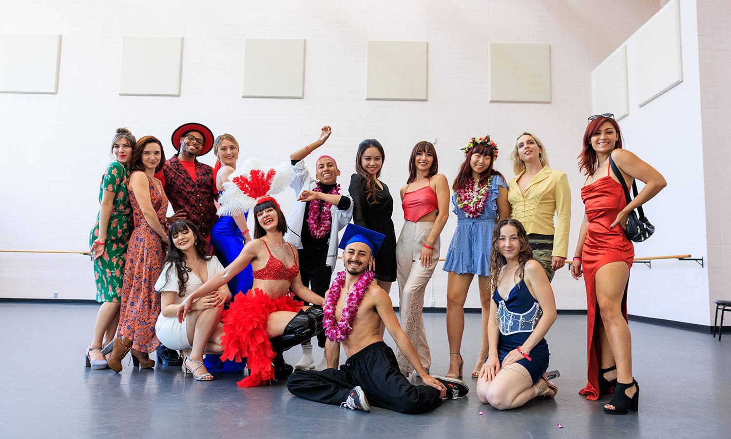 Dance students smile and pose for the camera in one of the dance studios.