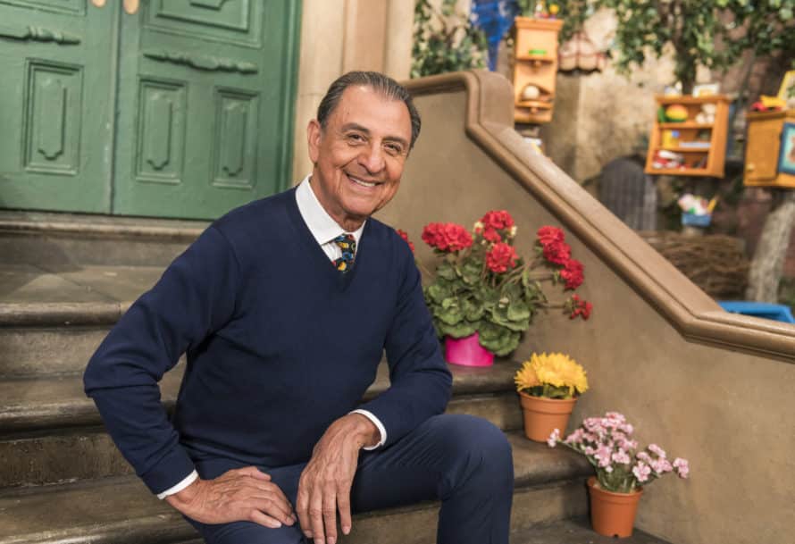 smiling man sitting on steps