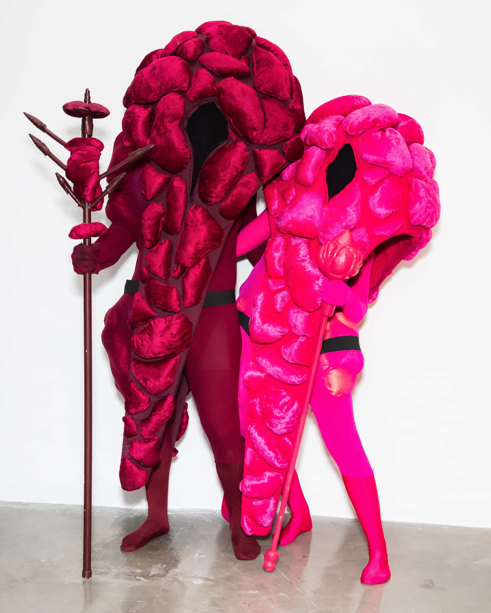 2 people in pink colored costumes
