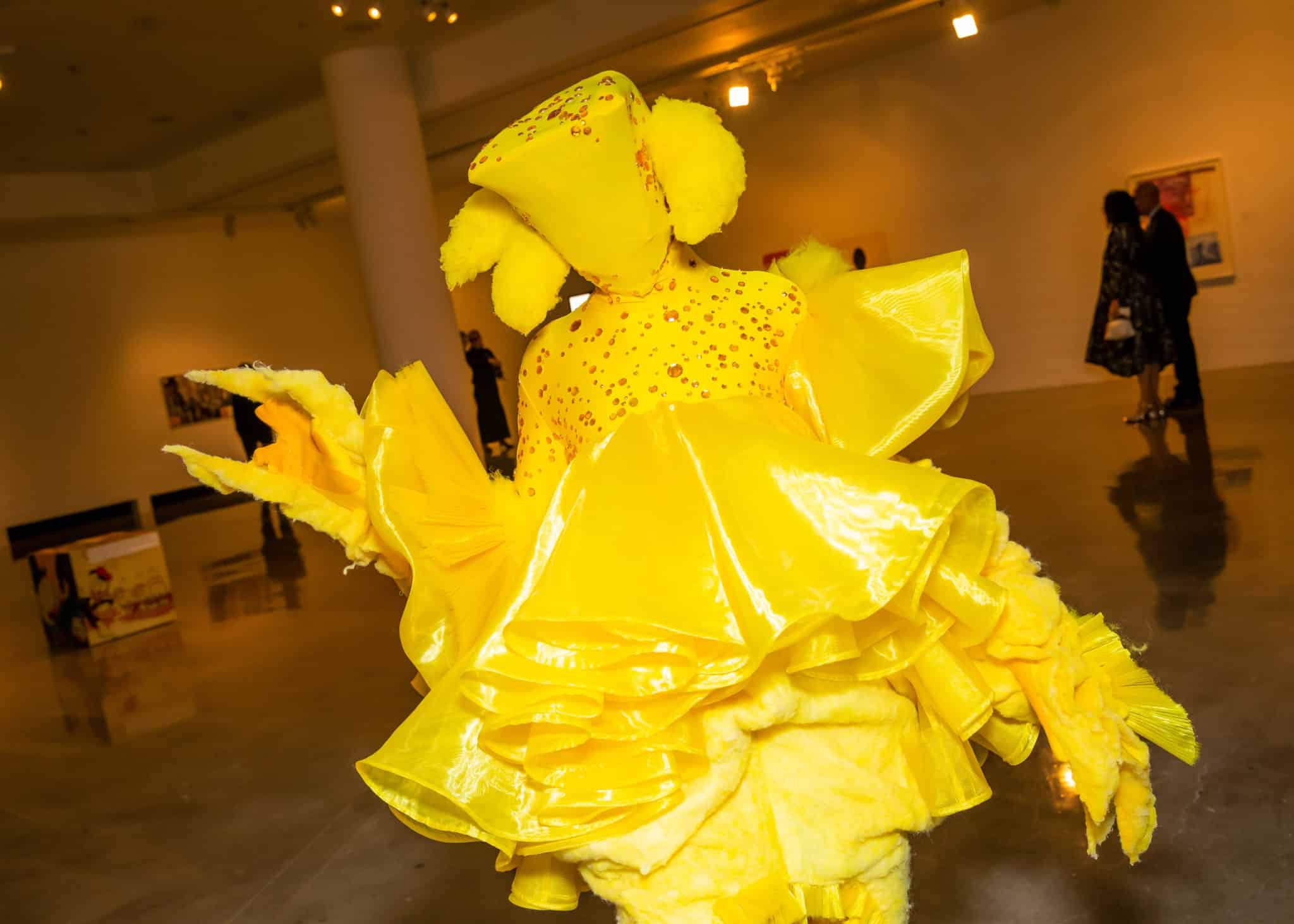 person in a yellow costume that is full body and hides the face.