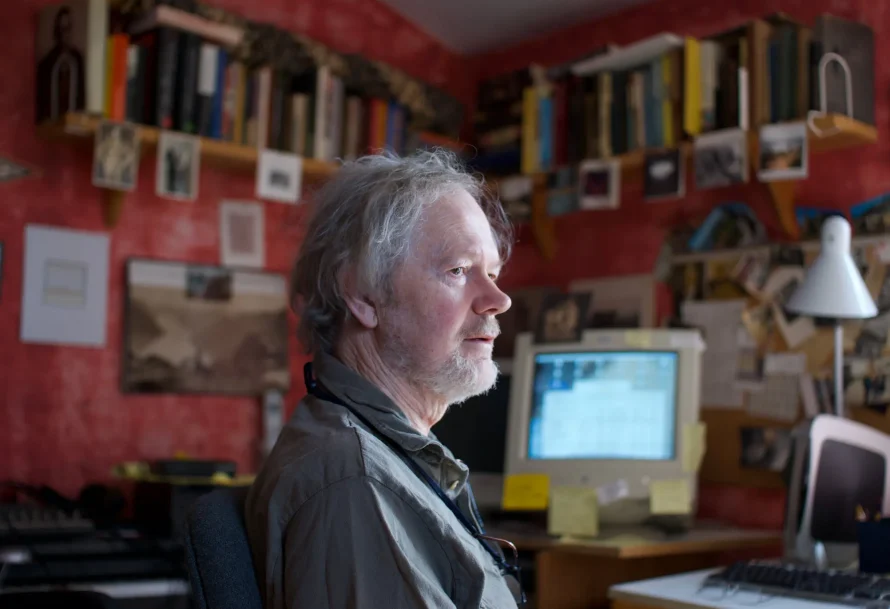 man sitting in front of computer